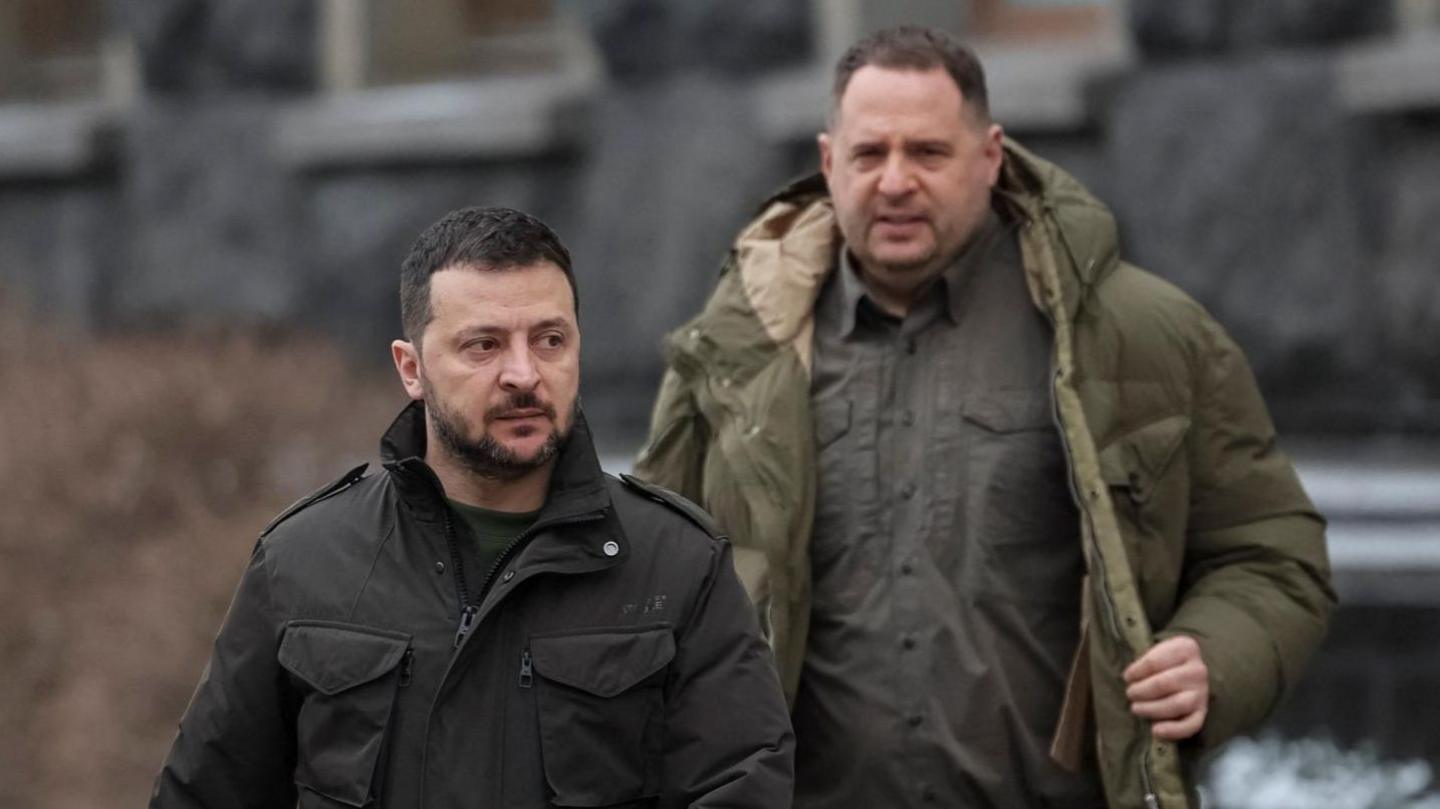 Zelensky and Yermak walking along, there's snow on the ground behind them