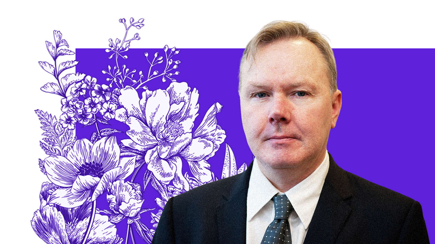 Sean Coughlan, royal correspondent and writer of Royal Watch newsletter, is seen in a formal portrait image wearing a suit and tie.