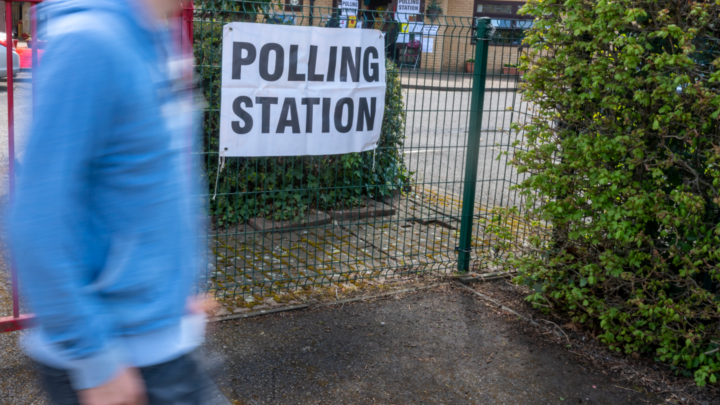 Man walking into a polling station