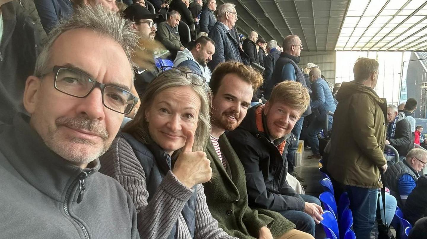 Scott Billison with his family during a previous game against Plymouth