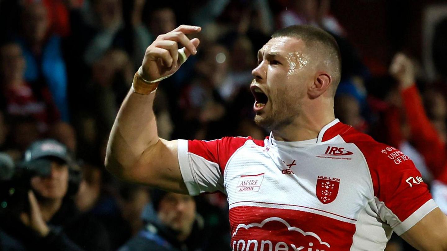 Hull KR's James Batchelor celebrates scoring the opening try against Warrington.