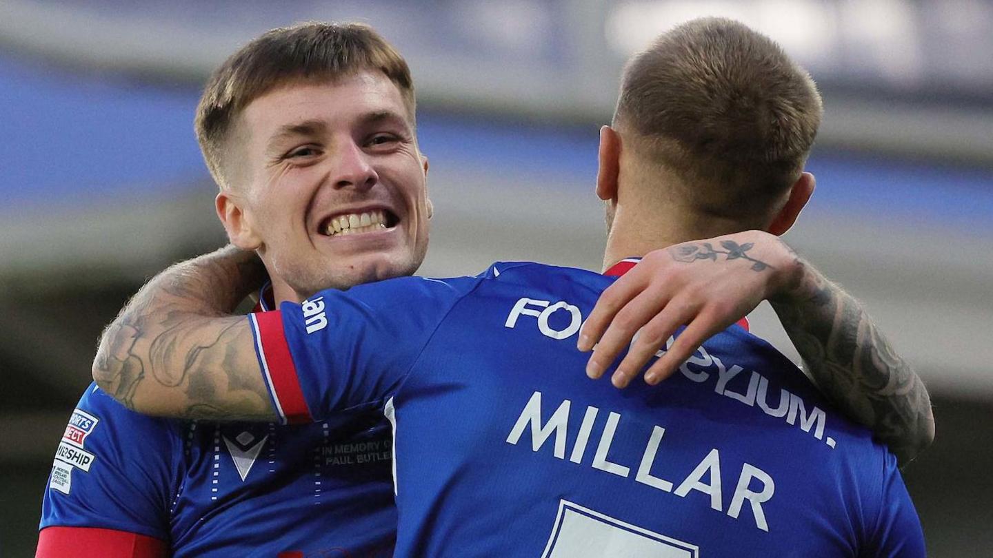 Chris McKee celebrates scoring against Portadown at Windsor Park