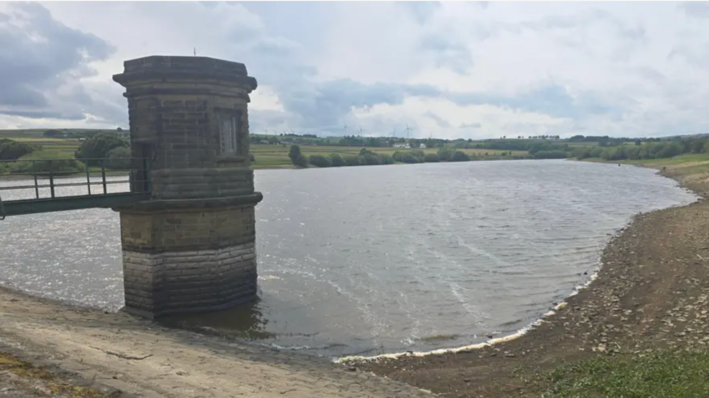 Reservoir near Penistone on a cloudy day showing low levels of water