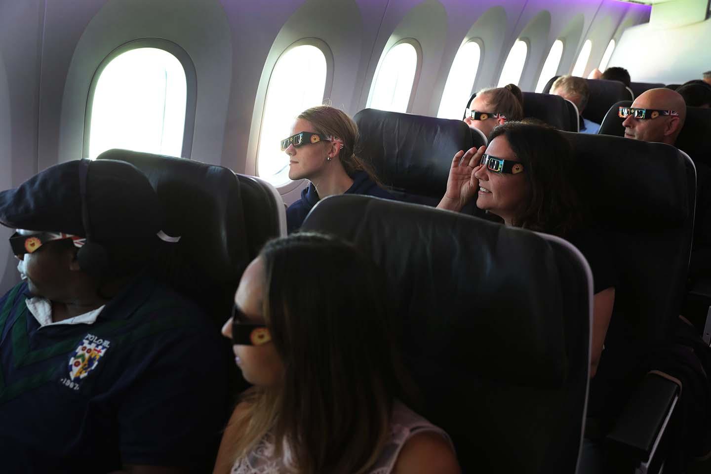 People watch eclipse from plane