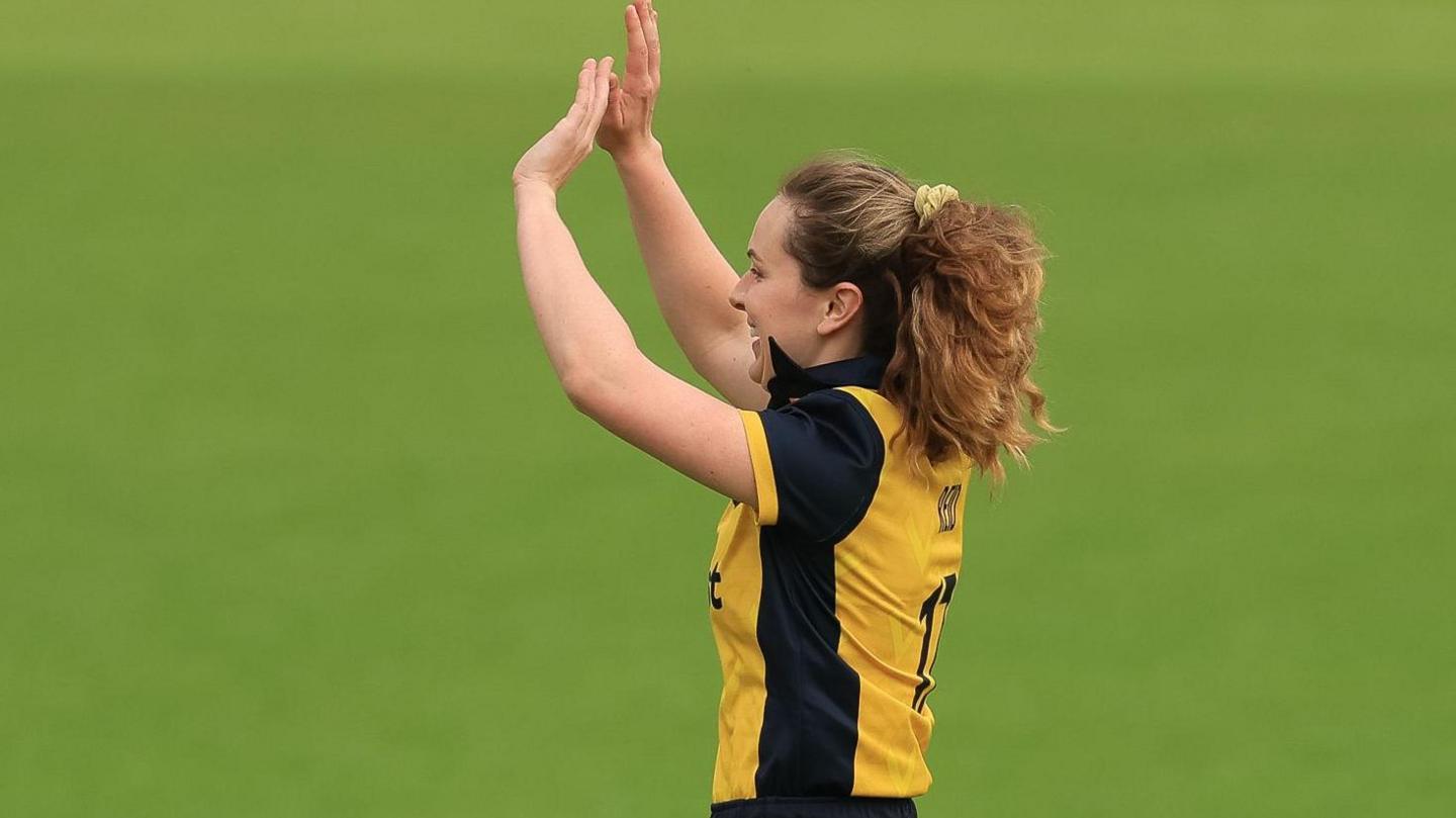 Nicole Reid celebrates taking a wicket