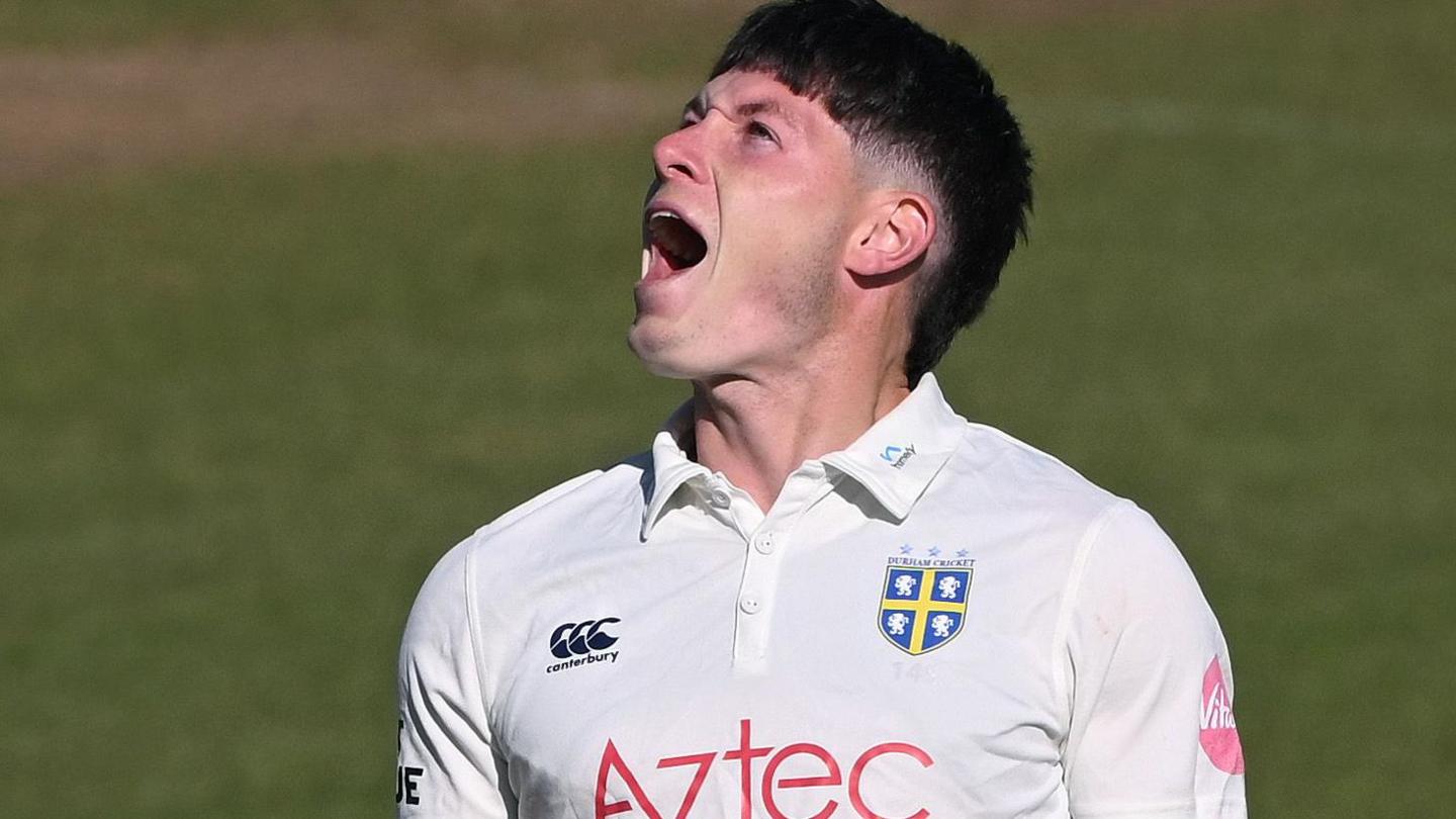 Matthew Potts celebrates taking a wicket