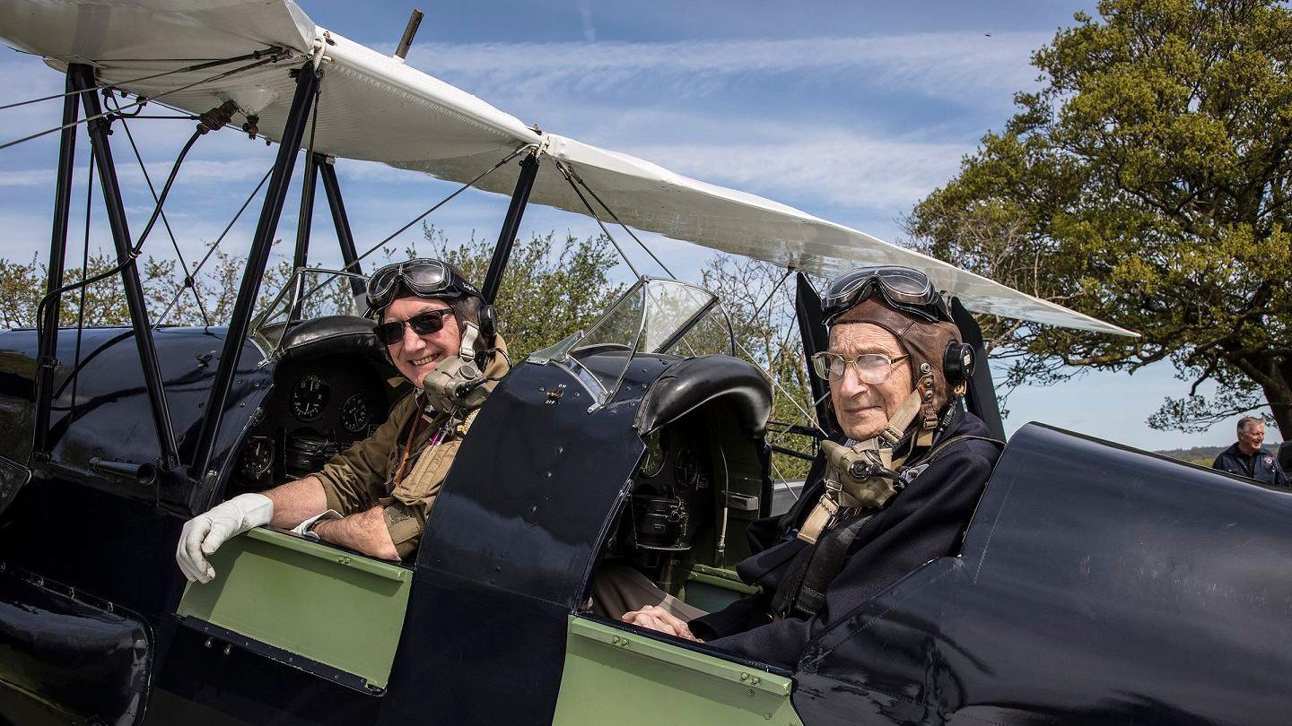 Terry Dann and John Cooper in the Tiger Moth