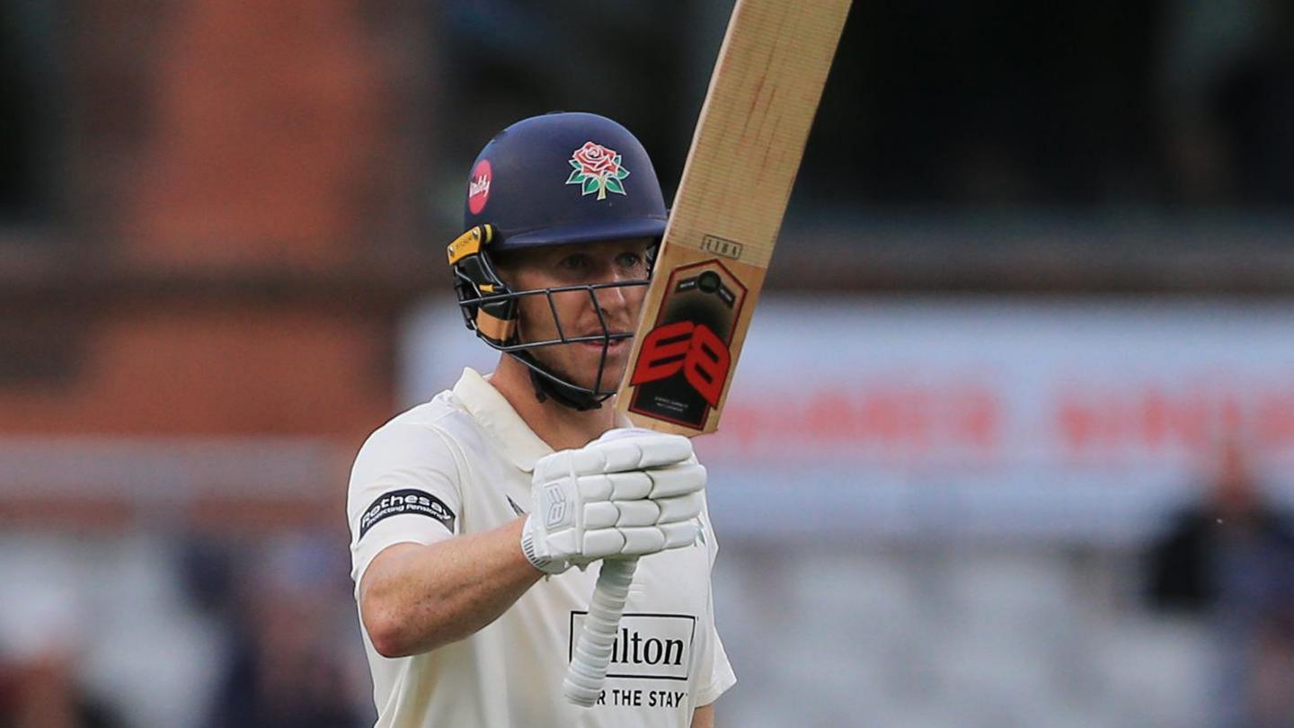 Luke Wells raises his bat to celebrate another 50 for Lancashire