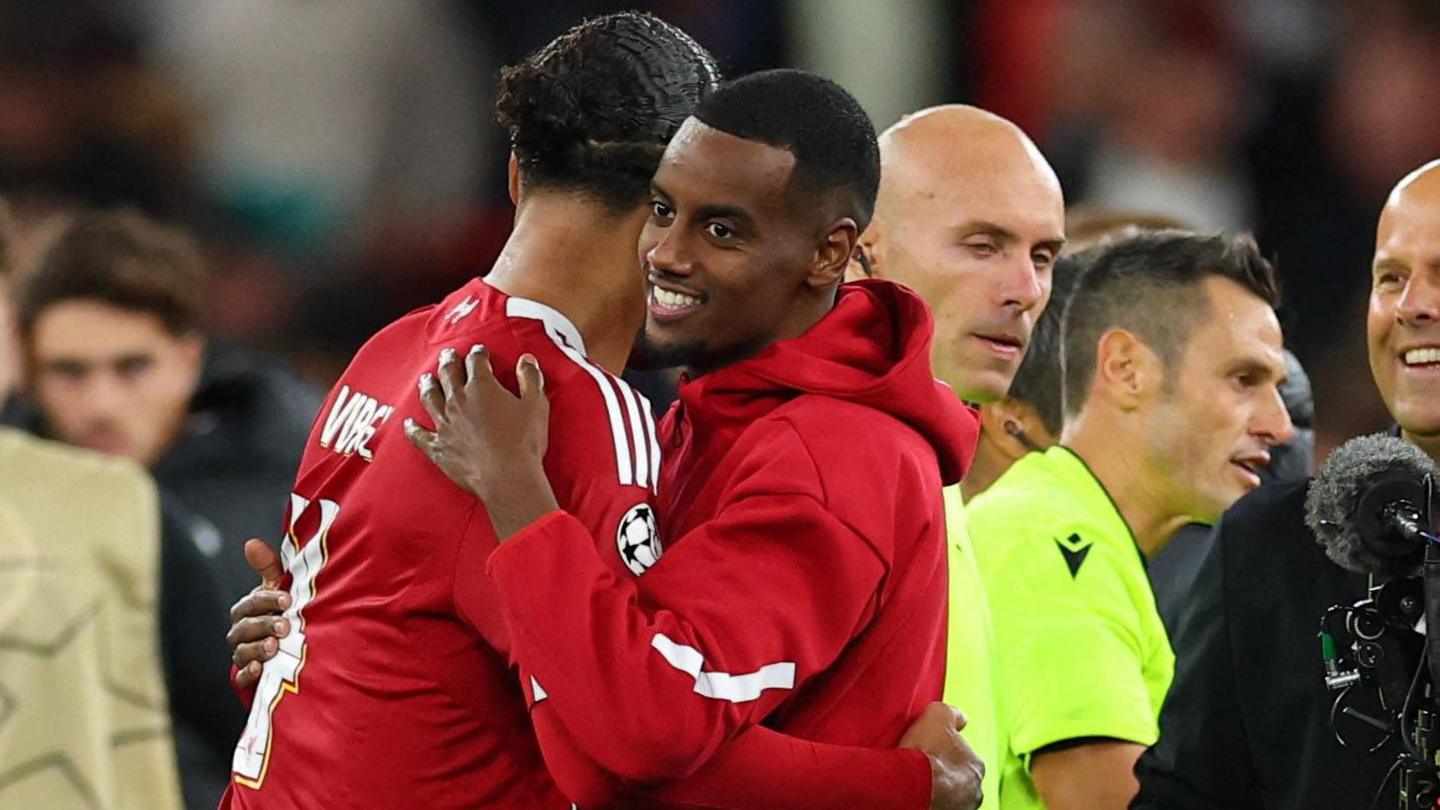Liverpool's new £125m striker Alexander Isak congratulates match-winner Virgil van Dijk at the end of the Champions League win against Atletico Madrid