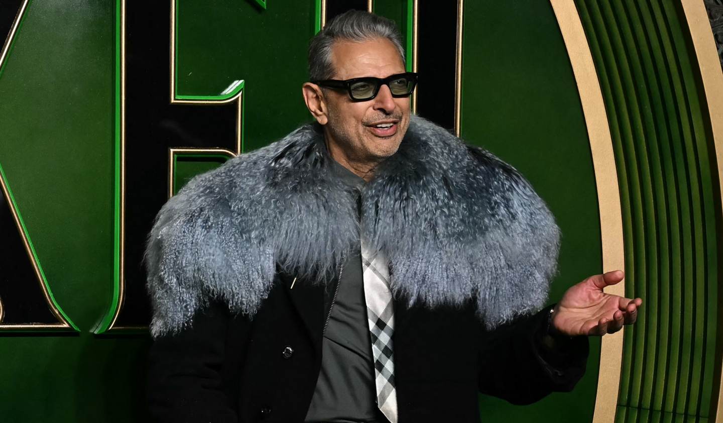 Jeff Goldblum wore a long black coat and a fur shawl to the London premiere of the film Wicked