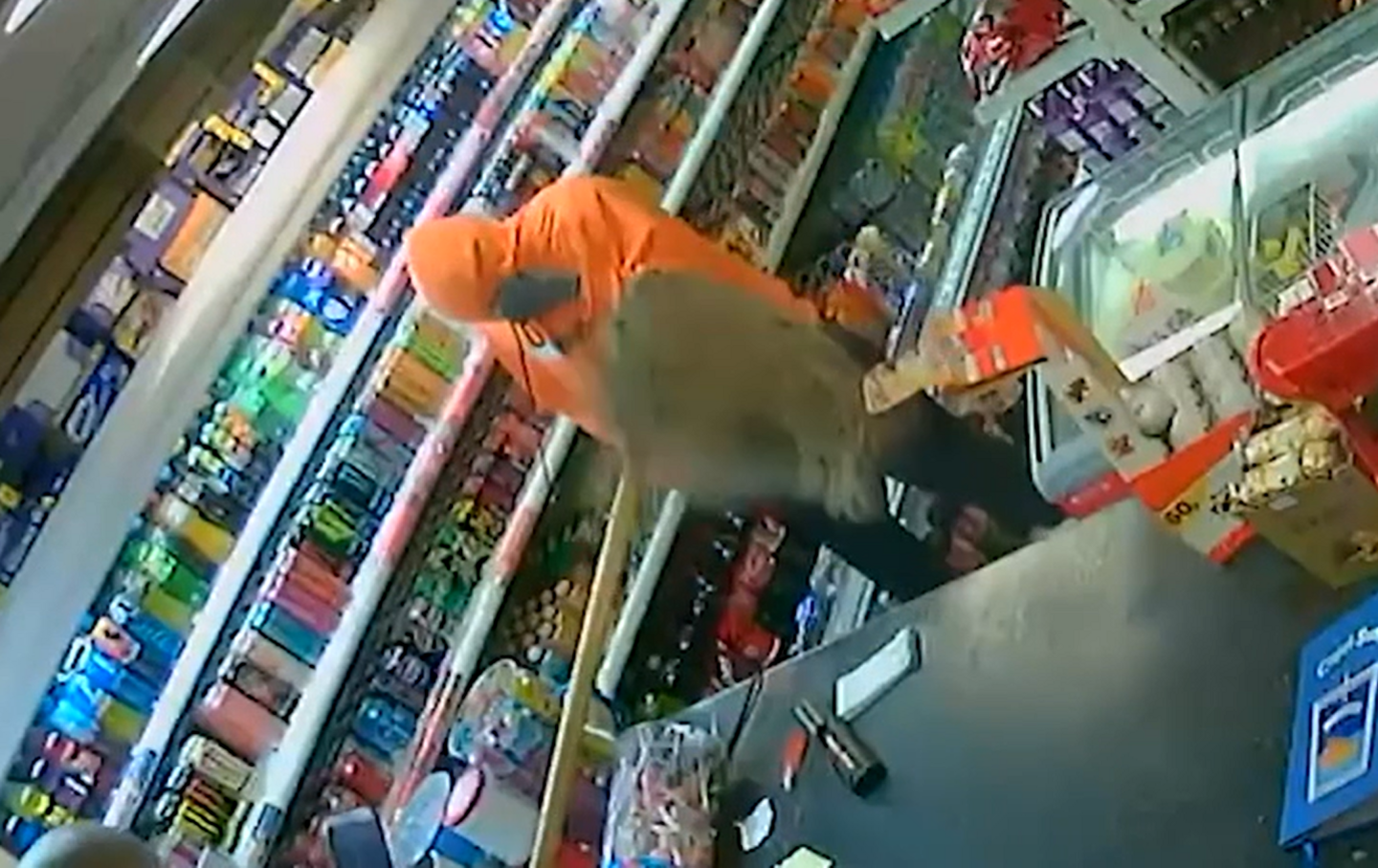 CCTV footage of robber being fought off using mop