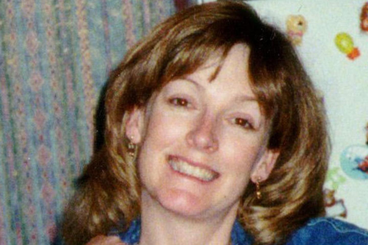 Arlene Fraser has shoulder-length brown hair and smiles at the camera. She is wearing a blue denim top.