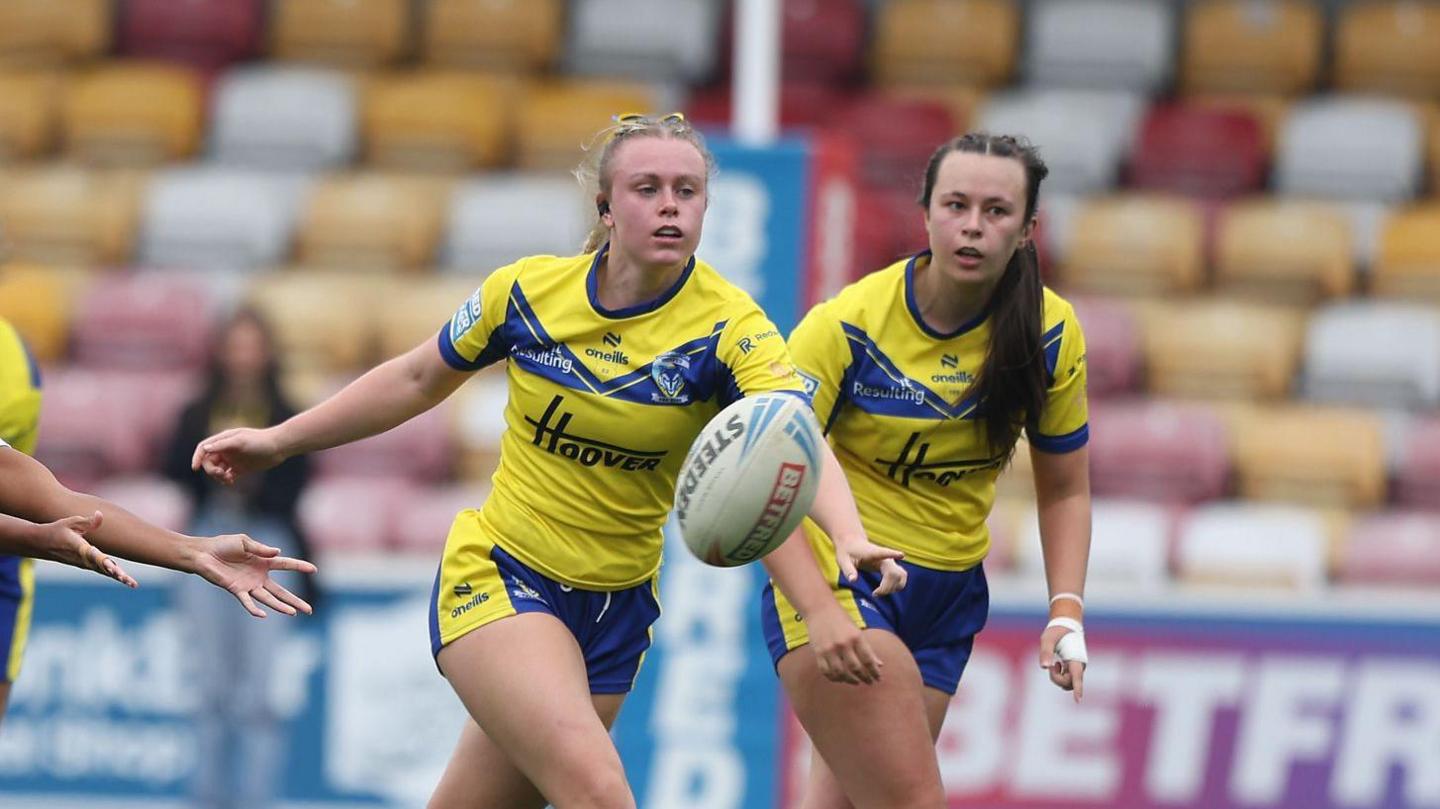 Two Warrington Wolves players following the ball during their recent defeat to York Valkyrie