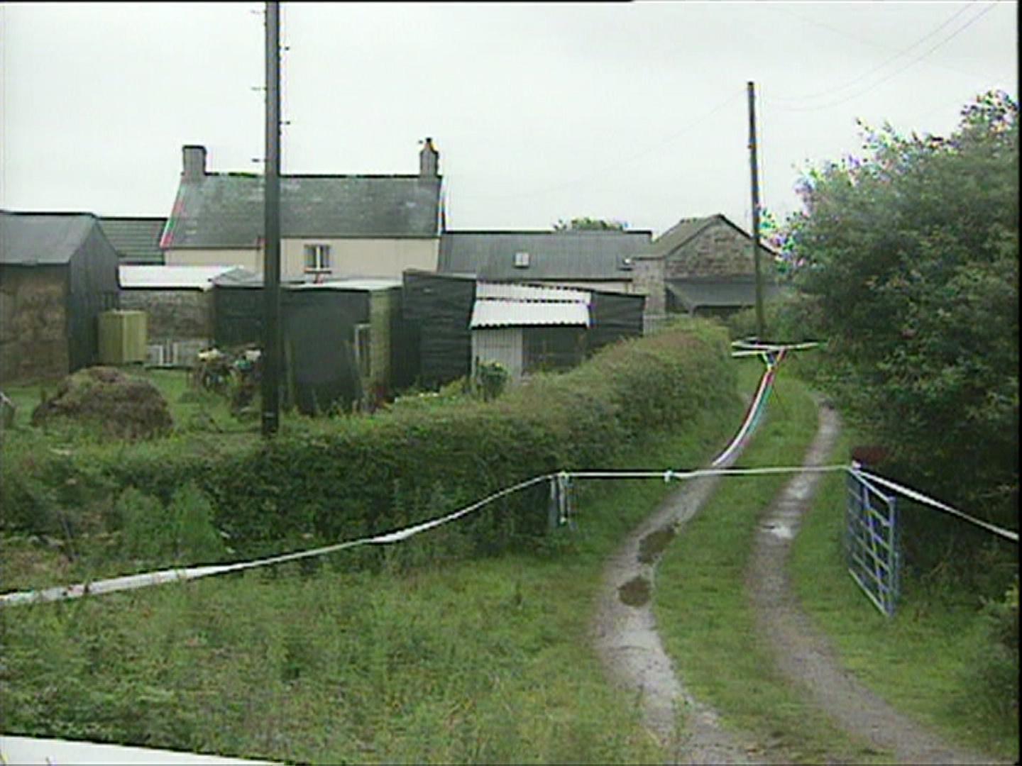 The Toozes' home surrounded by police tape