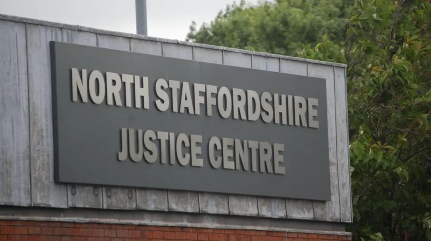 A large grey sign which reads North Staffordshire Justice Centre