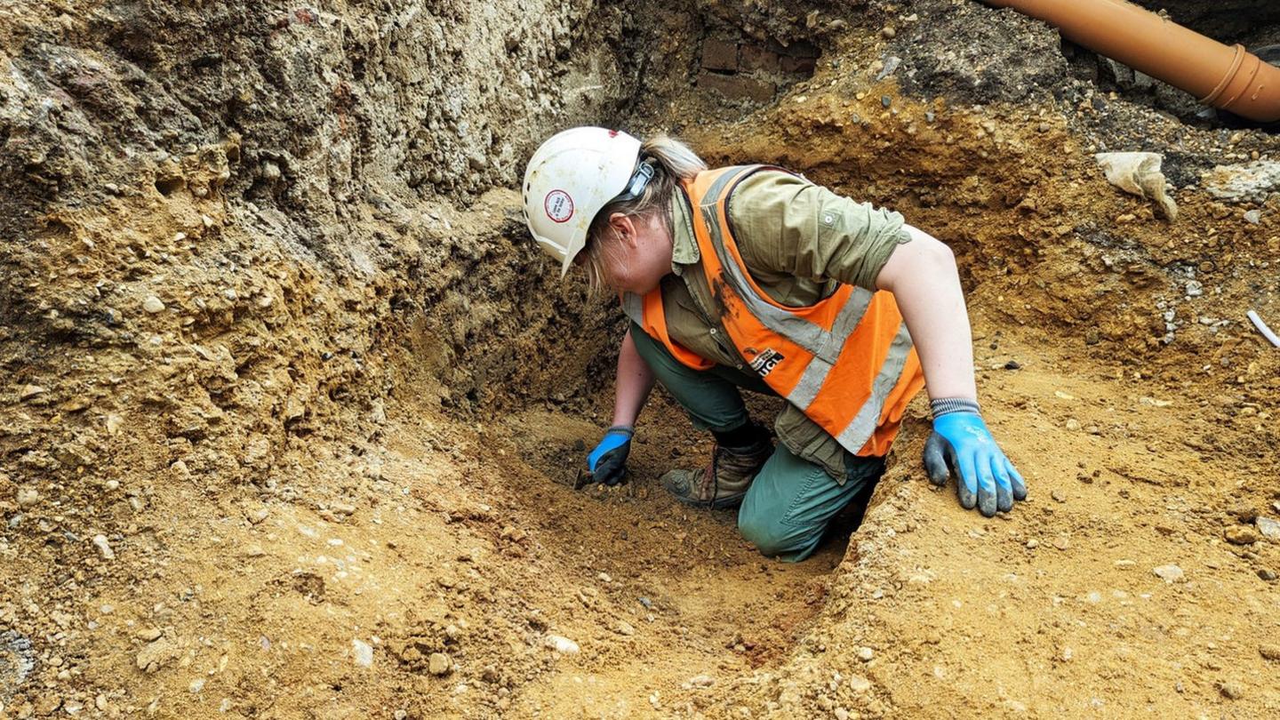 archaeologist excavating in the soil near the national gallery