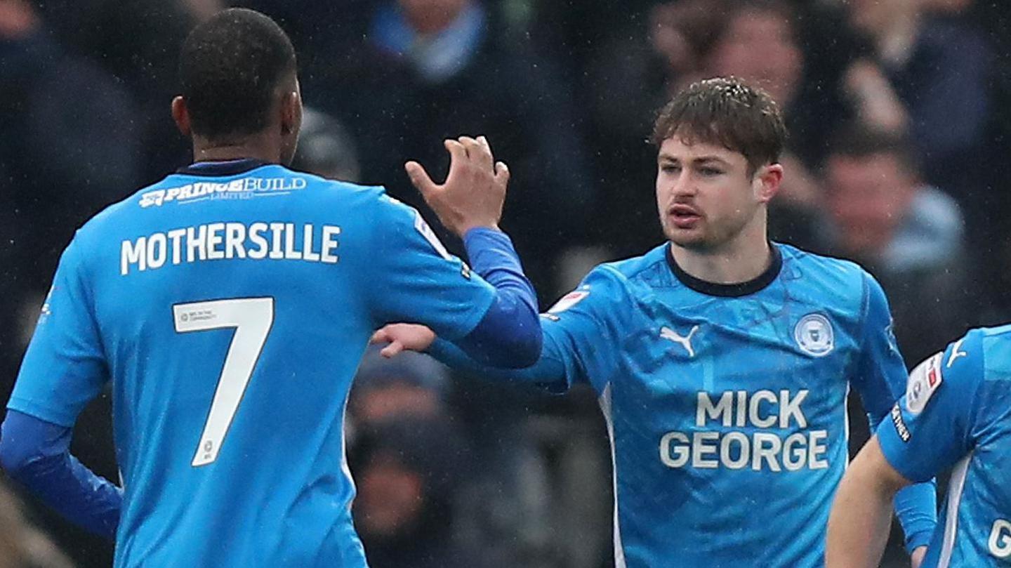 Cian Hayes is congratulated after scoring Peterborough's equaliser against Stevenage in League One