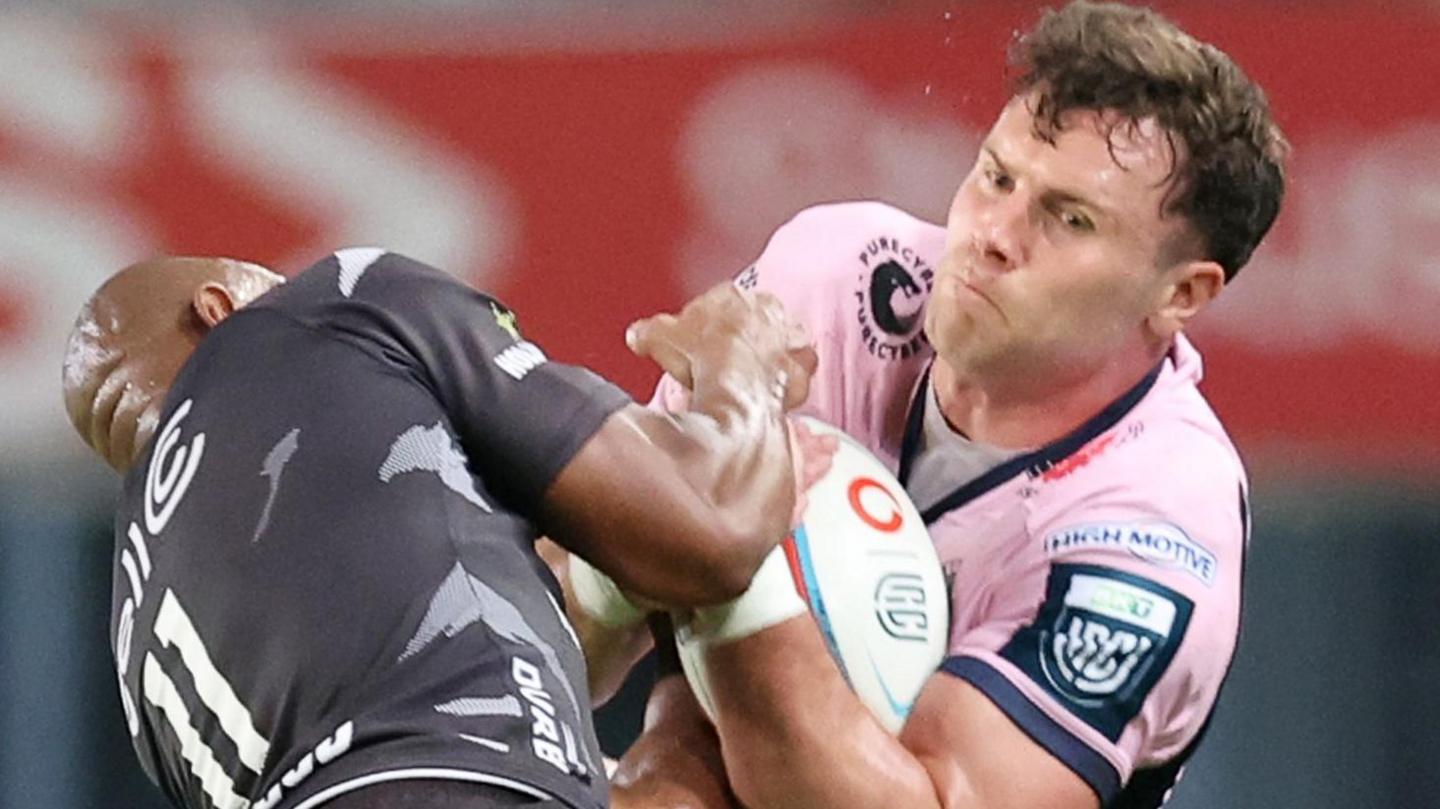 Cardiff wing Mason Grady claims a high ball against Sharks