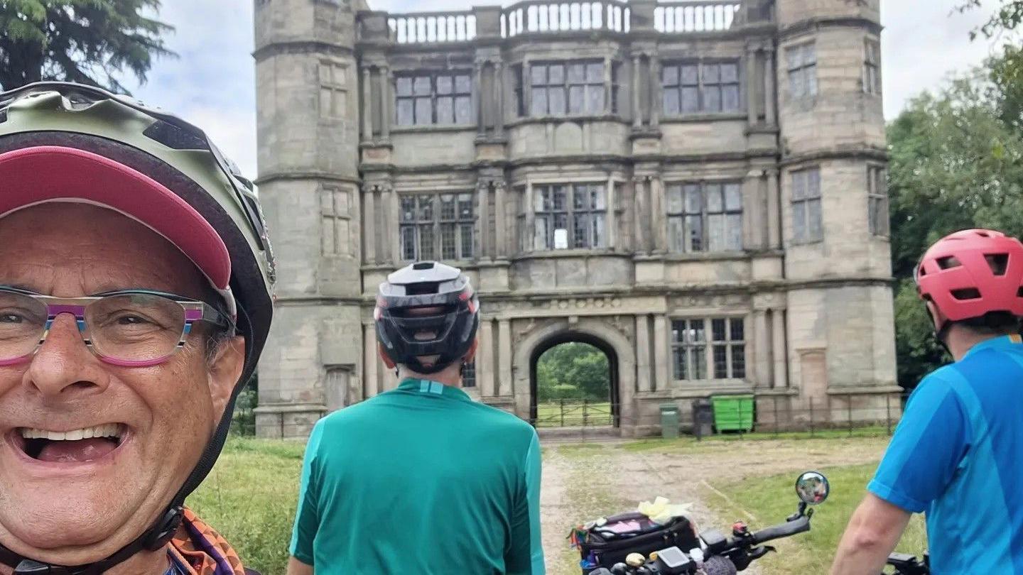 Timmy Mallet and two friends in front of the Tixall Gatehouse