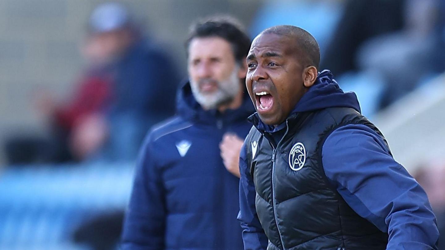 Darren Byfield bellows out instructions to his players during a Walsall game