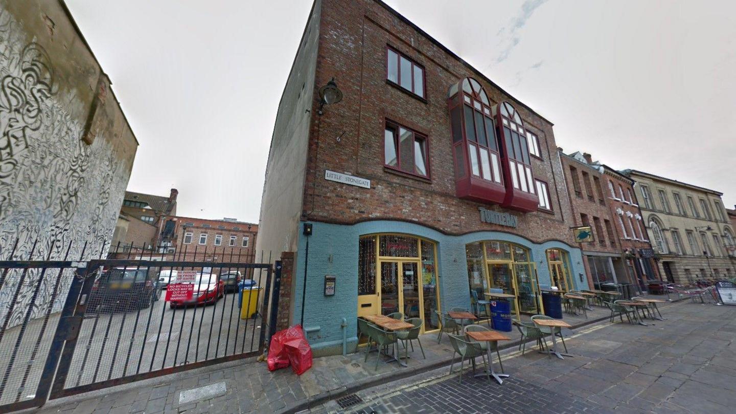 Restaurants and bars on Little Stonegate, which are connected by a shared roof.