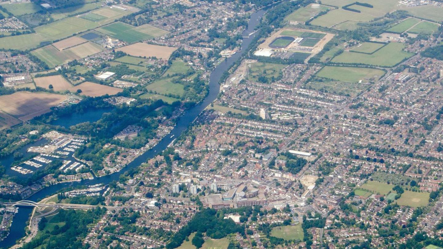 An aerial view of the town of Walton-on-Thames, beside the river and the Queen Elizabeth II reservoir