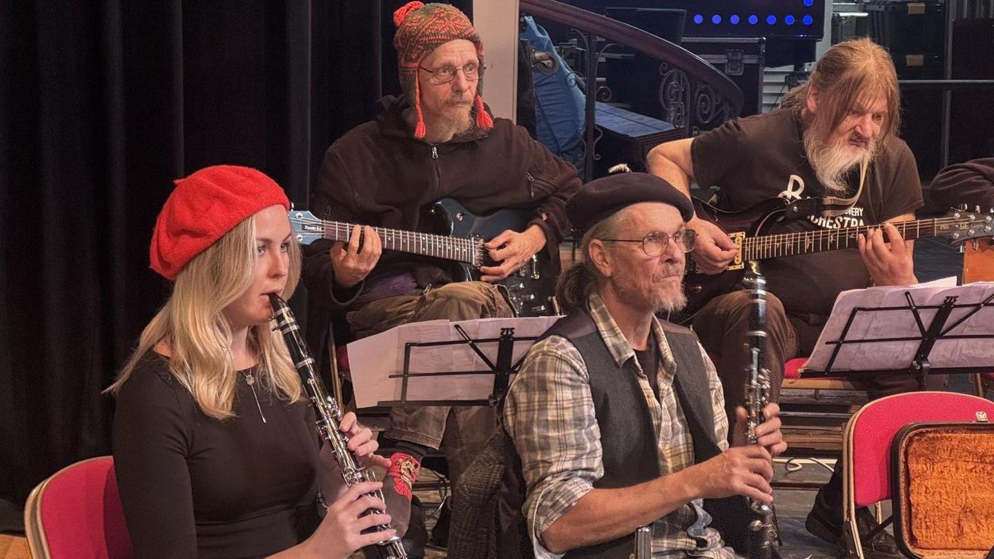 Members of the Bristol Recovery Orchestra play a variety of instruments as they rehearse ahead of a Bristol Drugs Project anniversary gala event