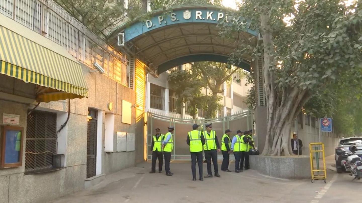 Security officials are standing outside Delhi Public School, RK Puram, which was among the schools that received a bomb threat email on 8 December.