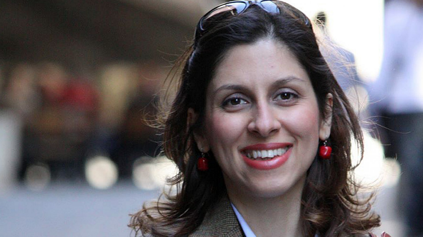 A family handout file photo of Nazanin Zaghari-Ratcliffe, as the British-Iranian charity worker. Nazanin has sunglasses on her head and has red earrings dangling from her ears as she looks towards the camera smiling. The background behind her shoulders is blurred.