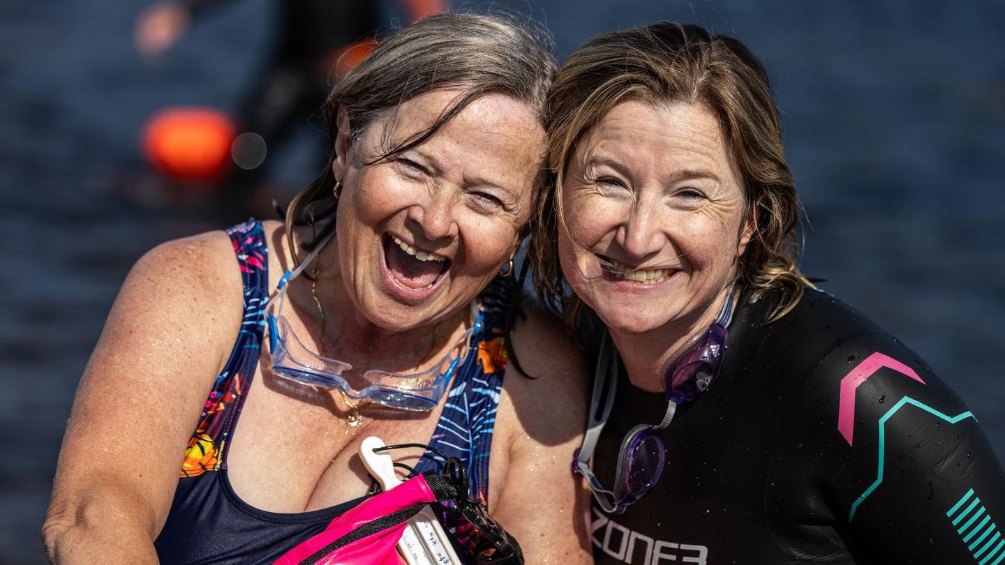 Two women smiling after completing the Kessock Ferry Swim