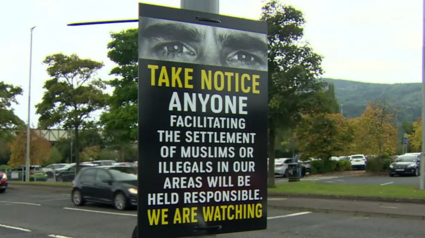 Poster on a lamppost that reads: "Take notice, anyone facilitating the settlement of Muslims of illegals in our areas will be held responsible. We are watching."