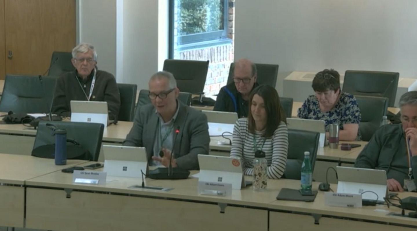 Councillors sat in meeting with laptops open in front of them