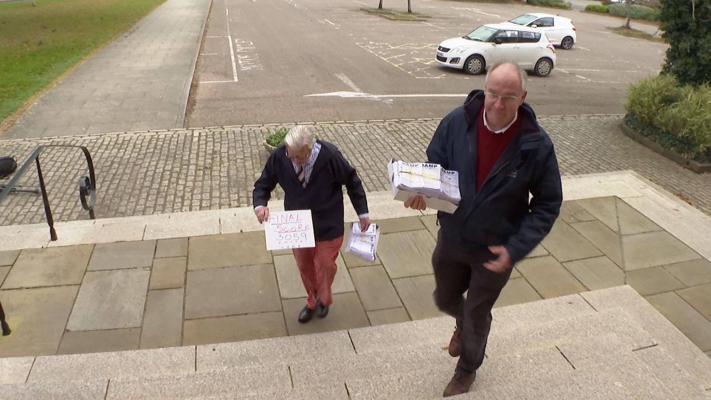 Campaigners present a petition to the county council