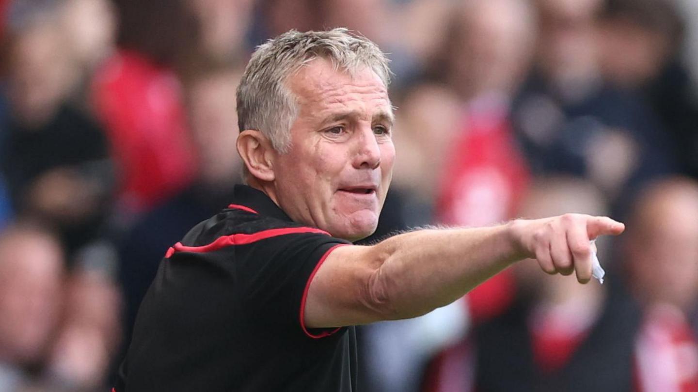 Phil Parkinson points during Wrexham's draw with Watford