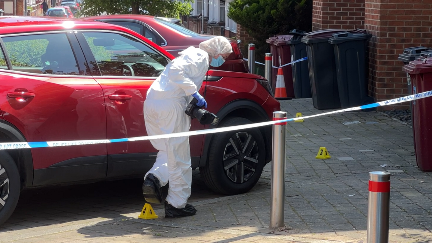 forensics lay out markers near car