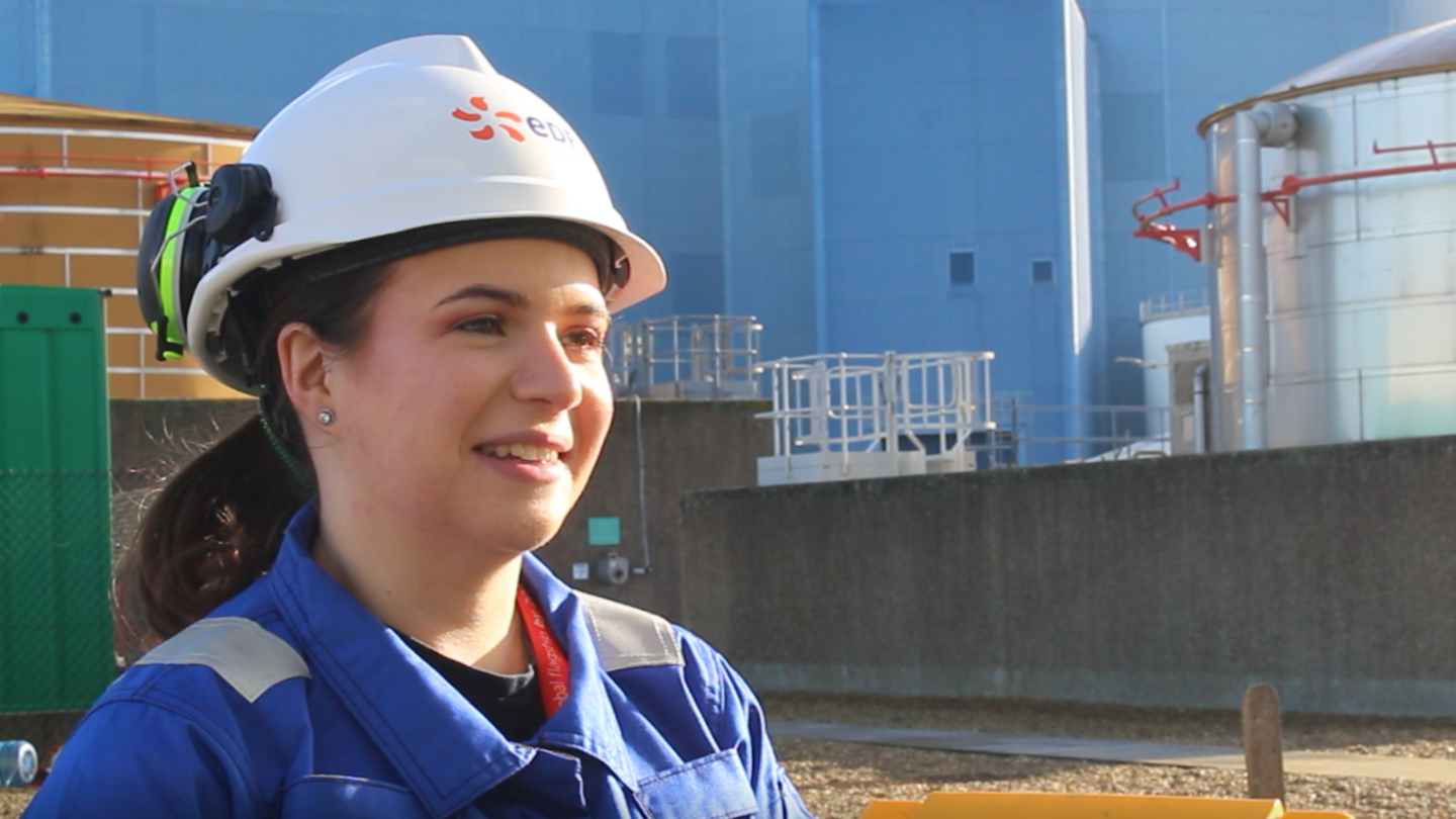 Jessica Willett - a Sizewell B employee wearing a hard hat looking just past the camera