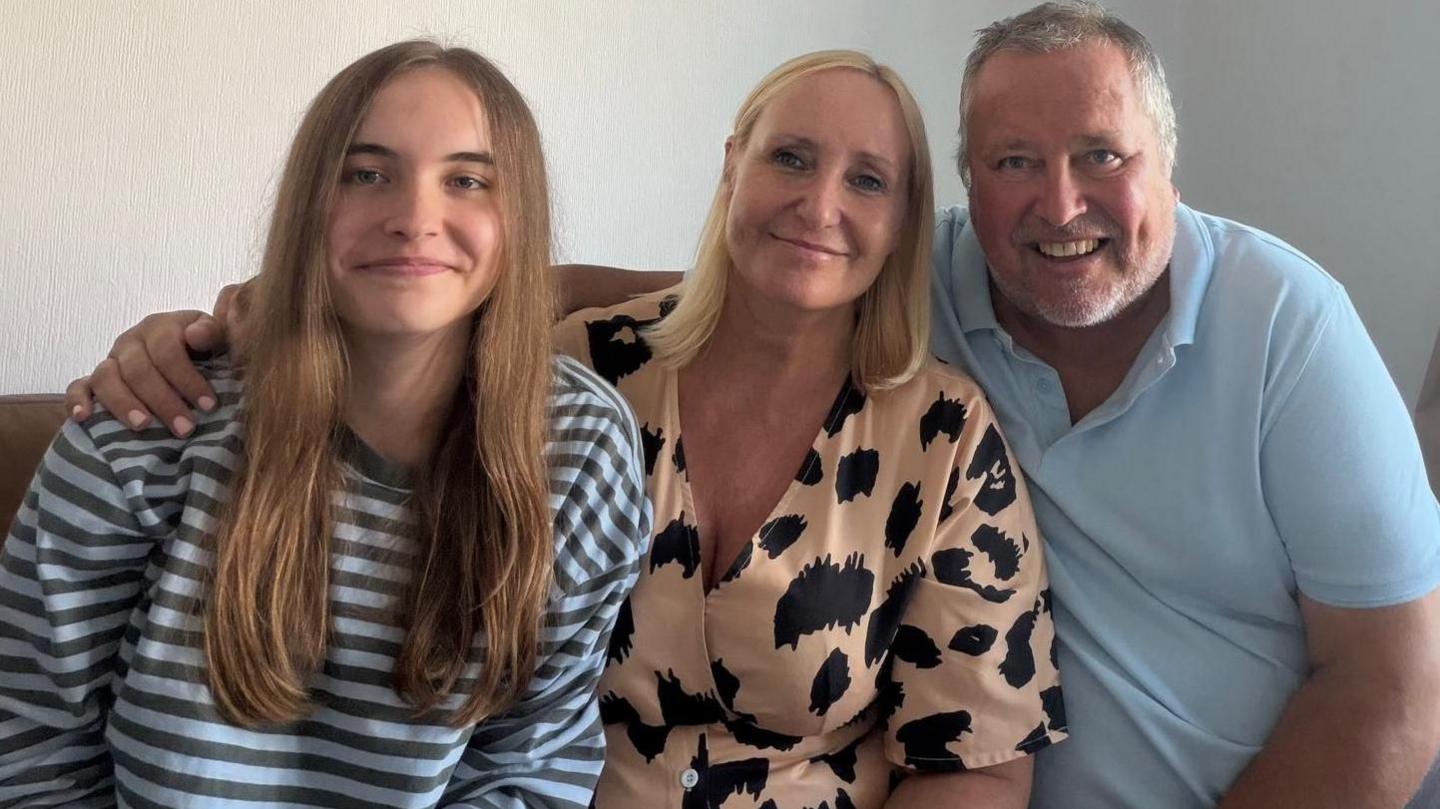 Ava-Grace with her parents, Karen and Paul