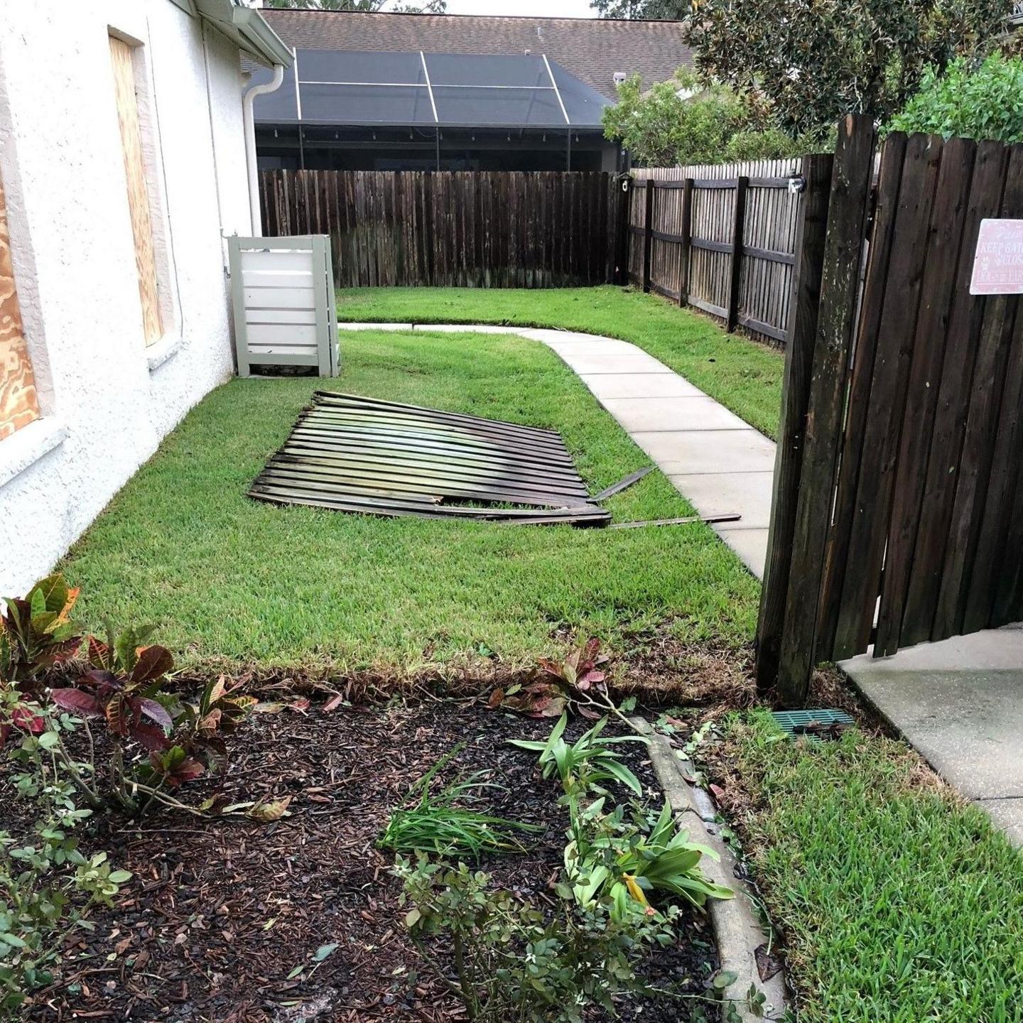 Damaged fences at the Frost family's home in Tampa. 