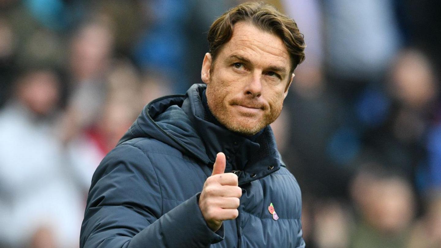 Burnley head coach Scott Parker gives a thumbs up to the crowd