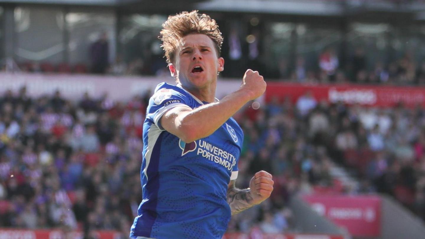 Adrian Segecic jumps in the air and pumps his fist as he celebrates a goal during his hat-trick for Portsmouth at Stoke City