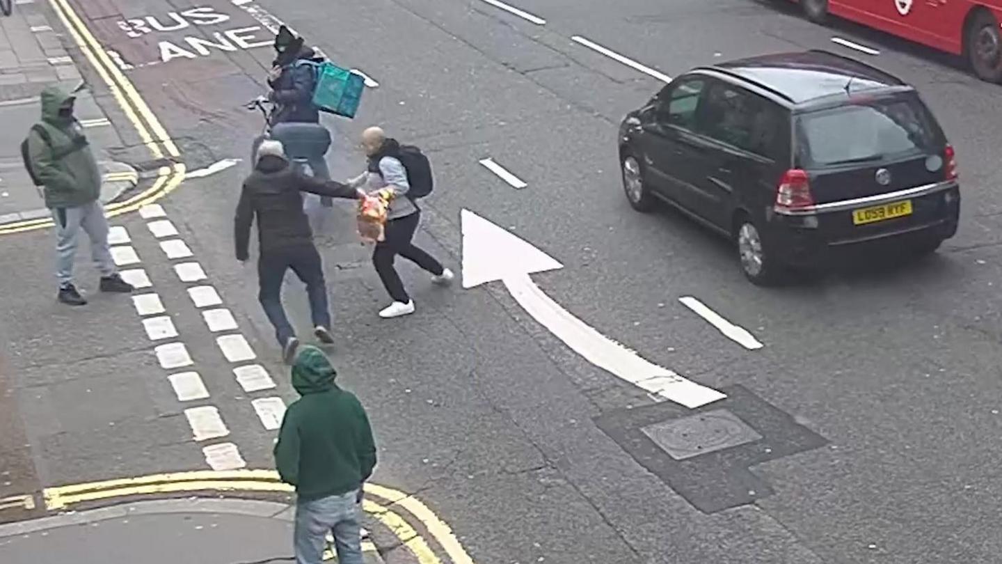 Still from undated handout CCTV footage issued by the Crown Prosecution Services (CPS) of Moussa Kadri (second left), attacking a man in Knightsbridge, on February 13, who was burning a copy of the Koran outside the Turkish consulate. Moussa Kadri was handed a 20-week prison sentence, suspended for 18 months at Southwark Crown Court on Tuesday. Issue date: Tuesday September 23, 2025.