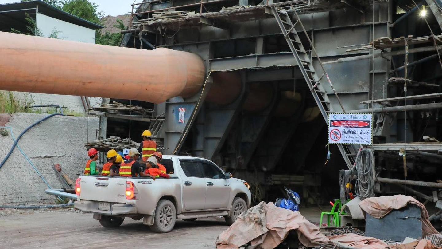 Rescue workers driving into the tunnel 