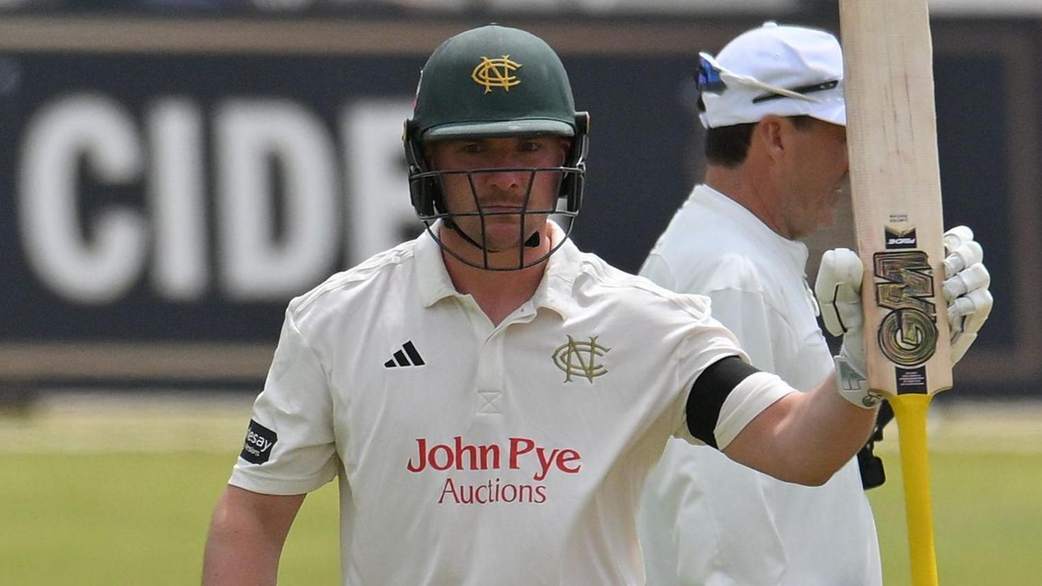 Liam Patterson-White raises his bat to the crowd