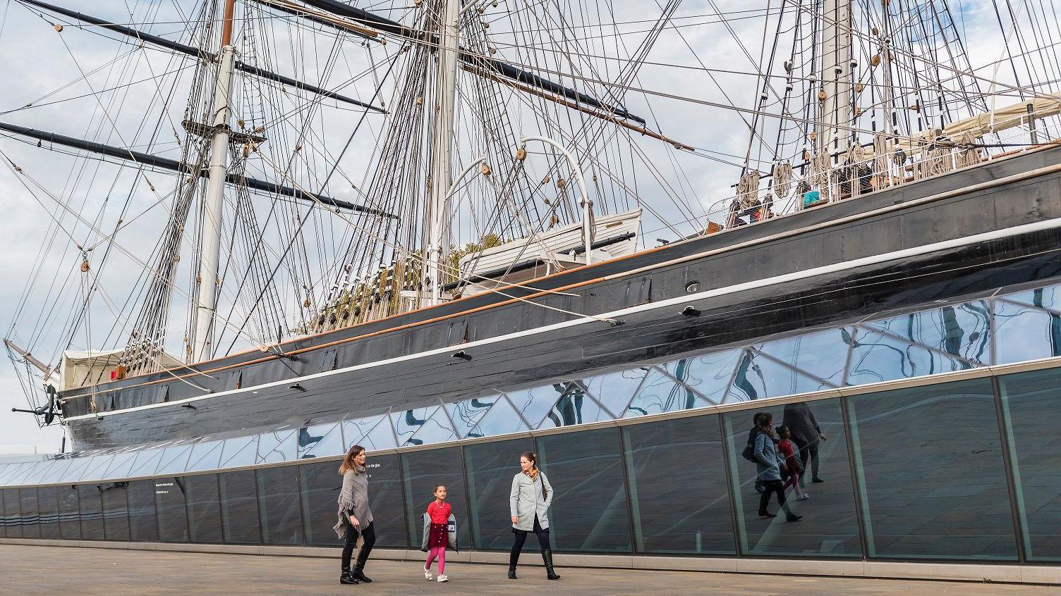 A closer image of the ship, with people walking by