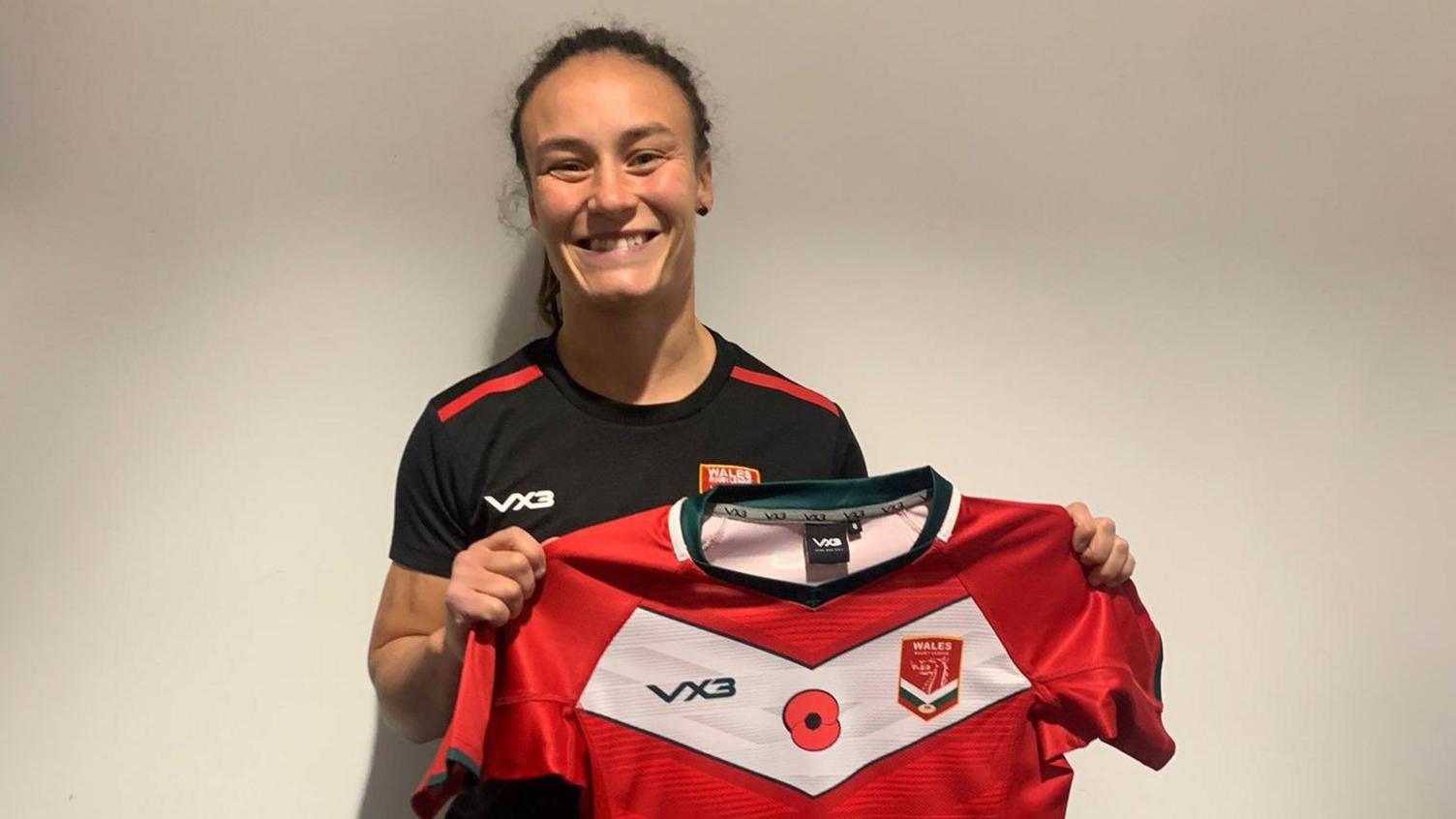 Brogan Evans poses with her Wales rugby league jersey