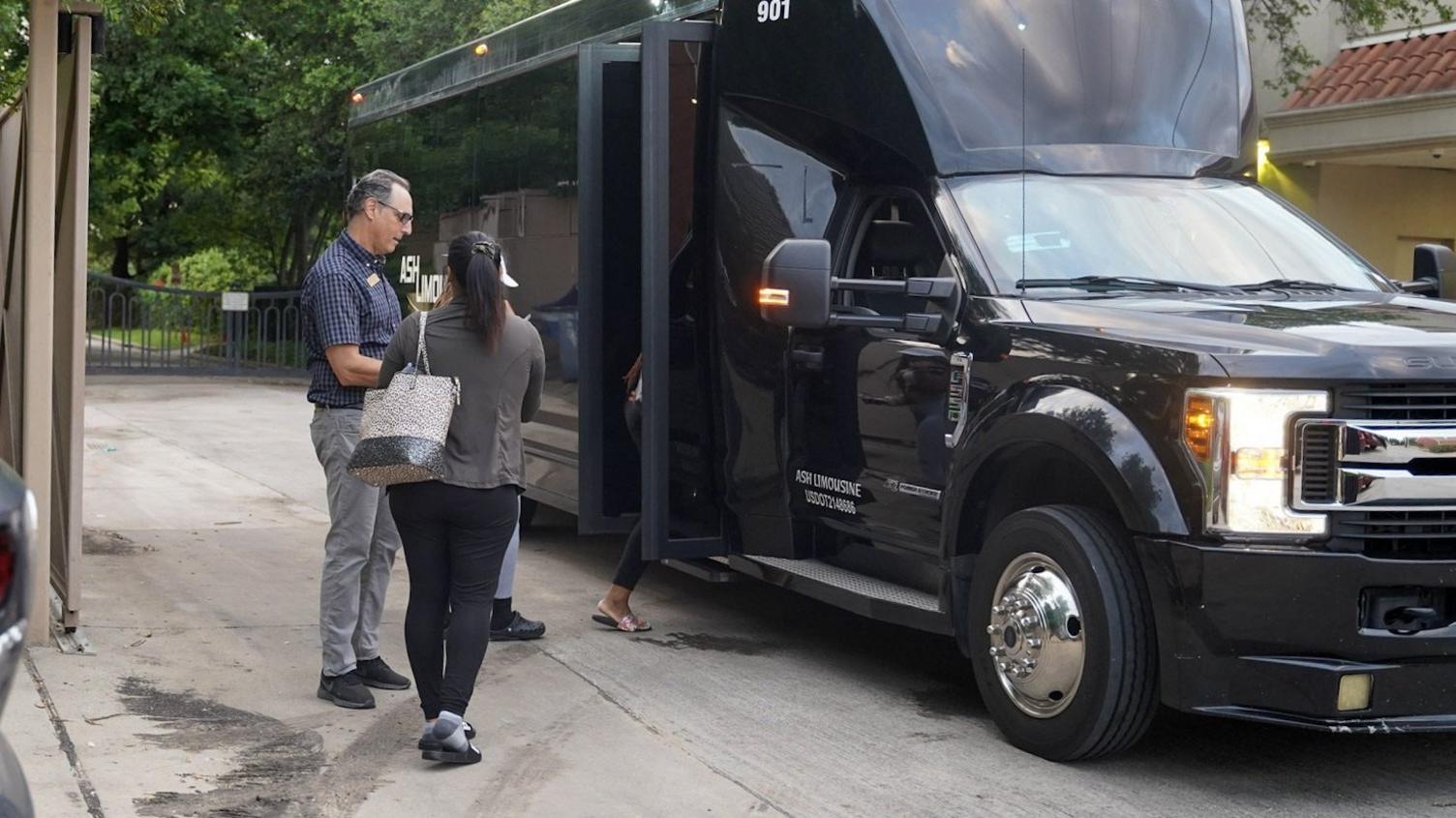 A patient boards a bus to begin traveling to New Mexico for an abortion.