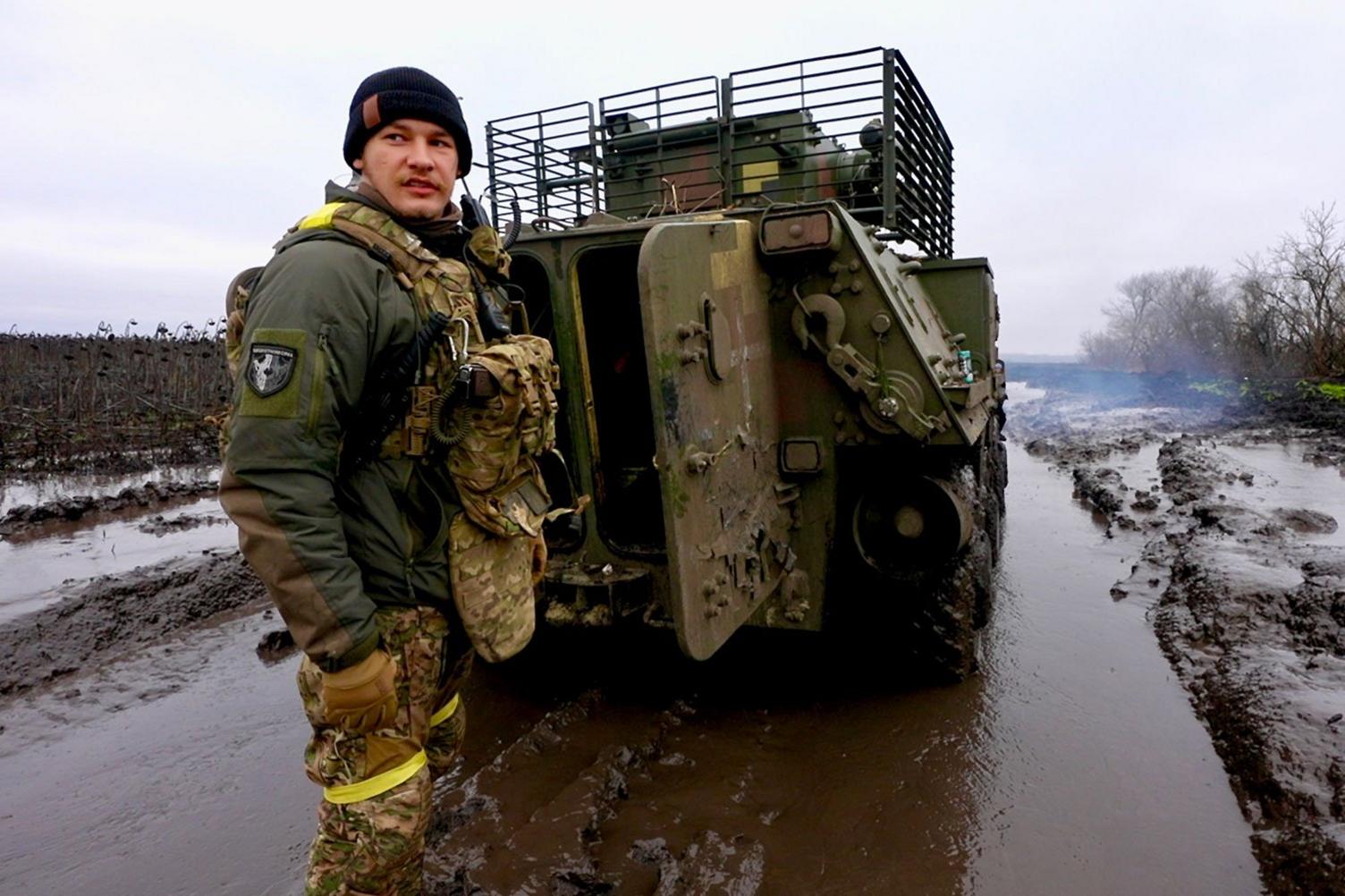 Eugene stands in front of the APC