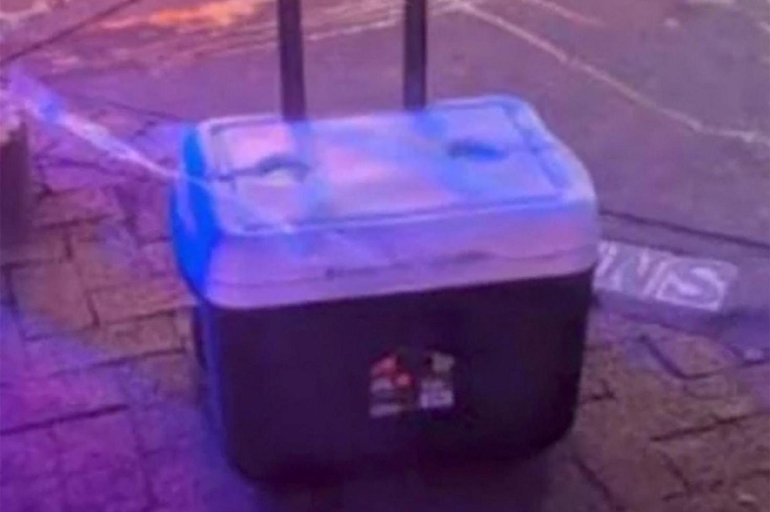 A cooler containing improvised explosive devices allegedly made by the suspect 