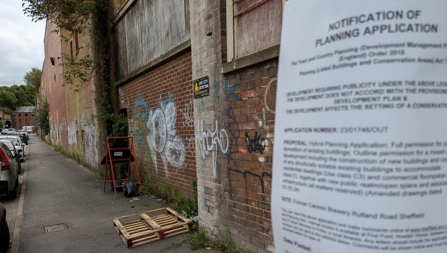 A planning application notice at the site