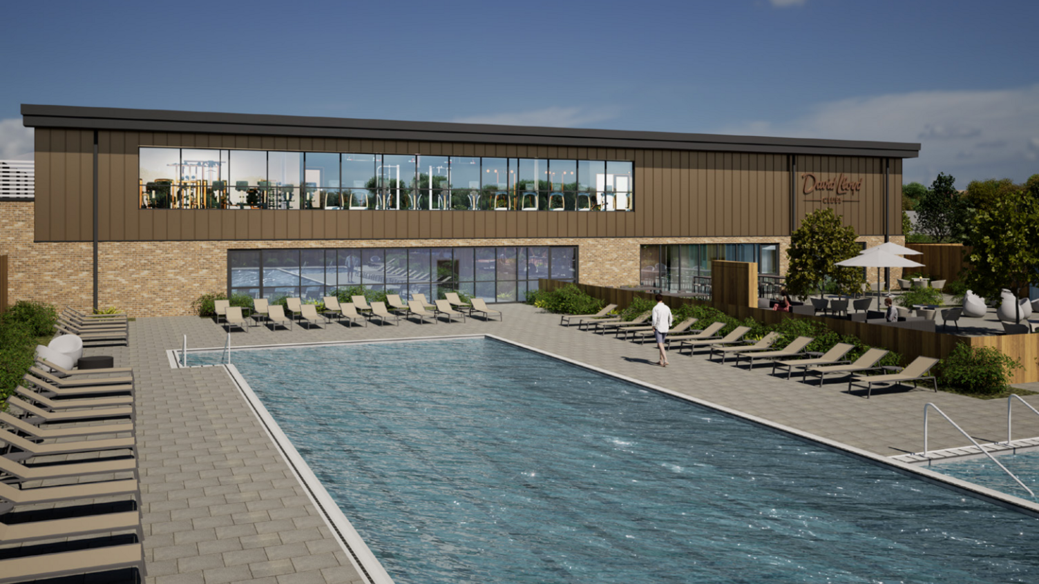 A CGI image of what the David Lloyd health club will look like. It shows a swimming pool surrounded by deck chairs. There is a two-storey, brown building in the background which has long windows.